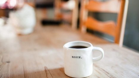 coffee mug that says “Begin”