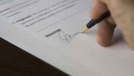 A person signing a document pertaining to franchise laws